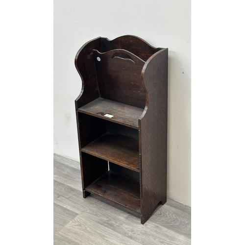 133 - An early 20th century oak three tier magazine rack bookcase - approx. 79cm high x 36cm wide x 20cm d... 