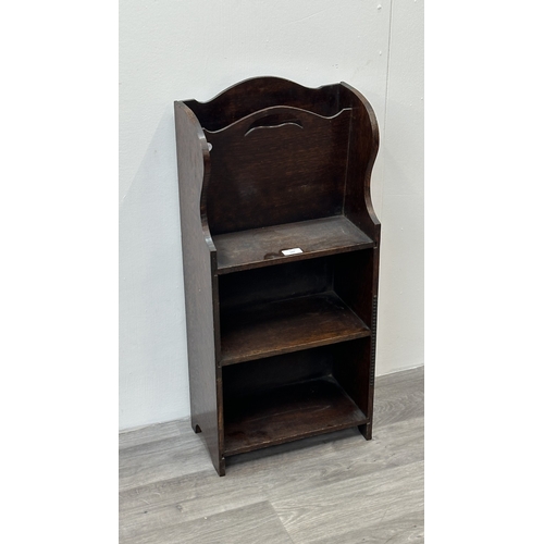133 - An early 20th century oak three tier magazine rack bookcase - approx. 79cm high x 36cm wide x 20cm d... 