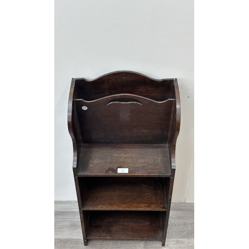 133 - An early 20th century oak three tier magazine rack bookcase - approx. 79cm high x 36cm wide x 20cm d... 
