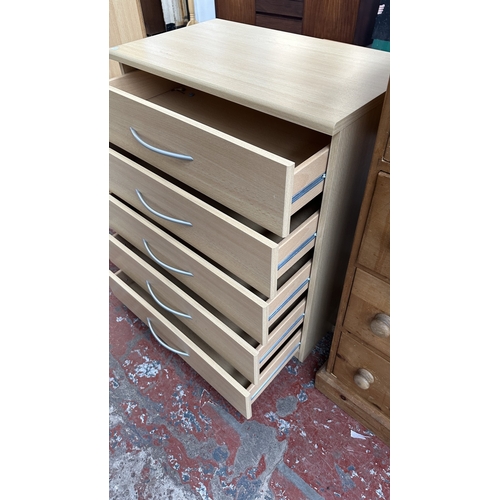 134 - A modern beech effect two piece bedroom suite comprising chest of drawers - approx. 87cm high x 72cm... 
