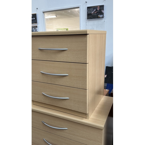 134 - A modern beech effect two piece bedroom suite comprising chest of drawers - approx. 87cm high x 72cm... 