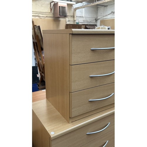 134 - A modern beech effect two piece bedroom suite comprising chest of drawers - approx. 87cm high x 72cm... 