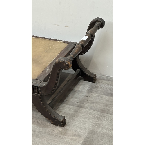 138 - A 1930s/40s leather and brass studded X-frame stool with turned beech handles and fabric upholstered... 