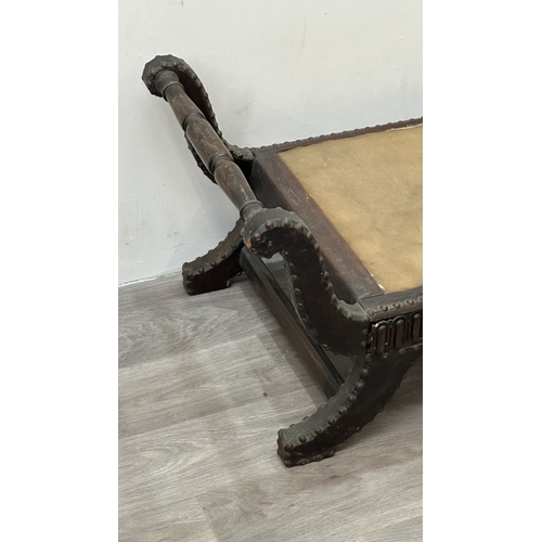 138 - A 1930s/40s leather and brass studded X-frame stool with turned beech handles and fabric upholstered... 