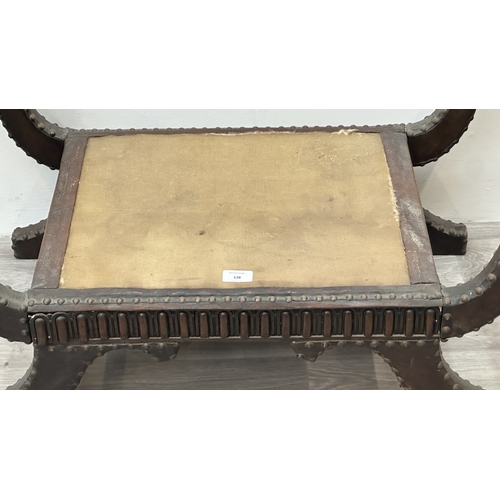 138 - A 1930s/40s leather and brass studded X-frame stool with turned beech handles and fabric upholstered... 