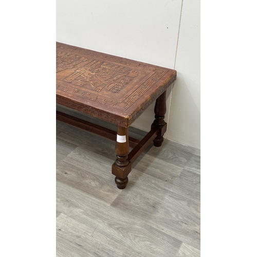 139 - A mid 20th century Peruvian hand-tooled leather and hardwood coffee table, attributed to Angel Pazmi... 