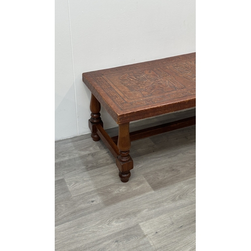 139 - A mid 20th century Peruvian hand-tooled leather and hardwood coffee table, attributed to Angel Pazmi... 
