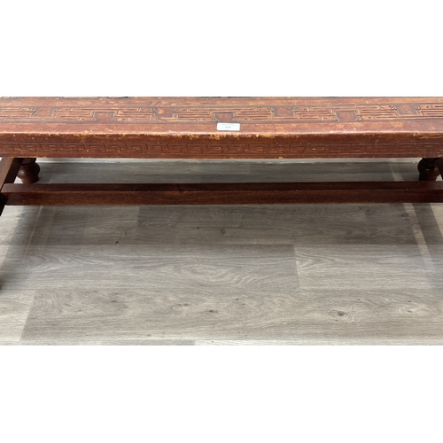 139 - A mid 20th century Peruvian hand-tooled leather and hardwood coffee table, attributed to Angel Pazmi... 