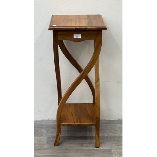 140 - An Indonesian teak jardinière/plant stand - approx. 75cm high x 36cm wide x 30cm deep