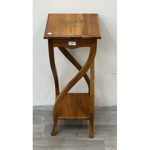 140 - An Indonesian teak jardinière/plant stand - approx. 75cm high x 36cm wide x 30cm deep