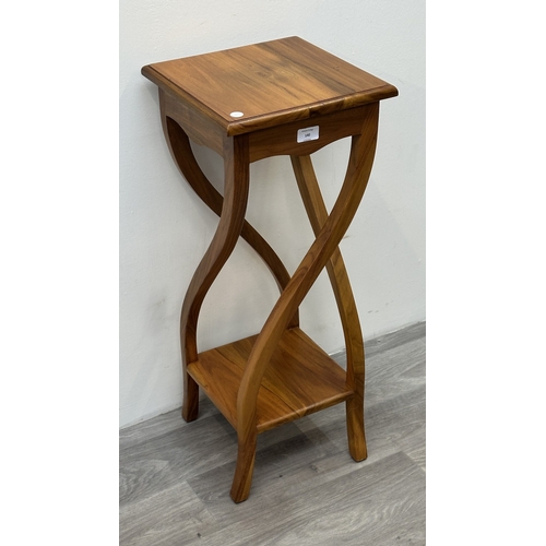 140 - An Indonesian teak jardinière/plant stand - approx. 75cm high x 36cm wide x 30cm deep