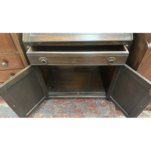 144 - A Wood Bros ‘Old Charm’ carved oak linenfold bureau - approx. 97cm high x 75cm wide x 42cm deep