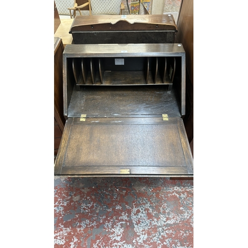 144 - A Wood Bros ‘Old Charm’ carved oak linenfold bureau - approx. 97cm high x 75cm wide x 42cm deep