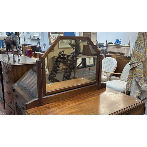 145 - A late 19th/early 20th century mahogany dressing chest with upper mirror and brushing slide - approx... 