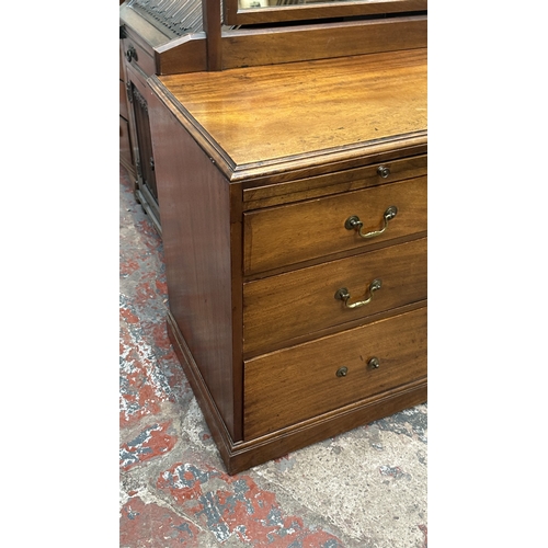 145 - A late 19th/early 20th century mahogany dressing chest with upper mirror and brushing slide - approx... 