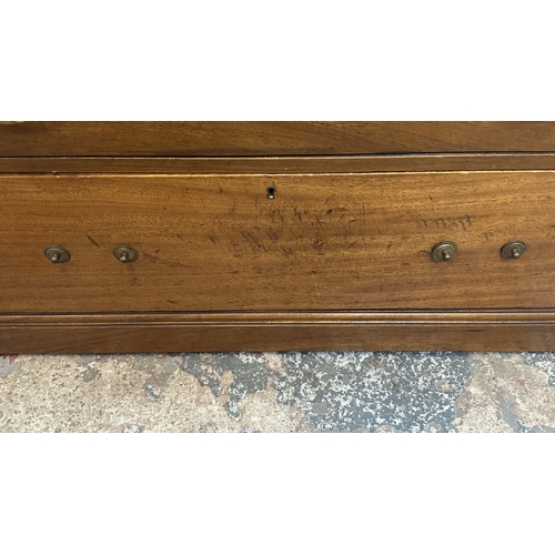 145 - A late 19th/early 20th century mahogany dressing chest with upper mirror and brushing slide - approx... 