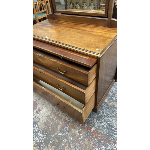 145 - A late 19th/early 20th century mahogany dressing chest with upper mirror and brushing slide - approx... 