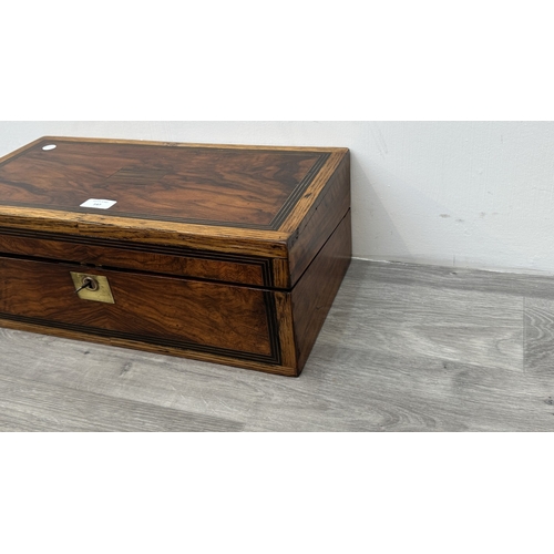 147 - A 19th century inlaid walnut and oak crossbanded writing slope with fitted interior and two glass in... 