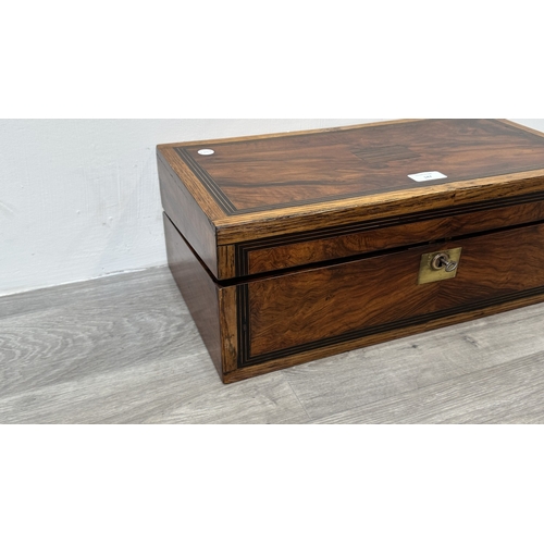 147 - A 19th century inlaid walnut and oak crossbanded writing slope with fitted interior and two glass in... 