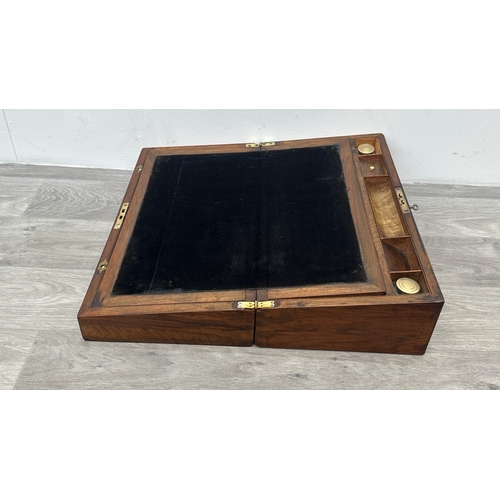 147 - A 19th century inlaid walnut and oak crossbanded writing slope with fitted interior and two glass in... 
