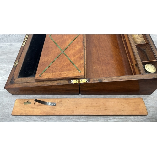 147 - A 19th century inlaid walnut and oak crossbanded writing slope with fitted interior and two glass in... 