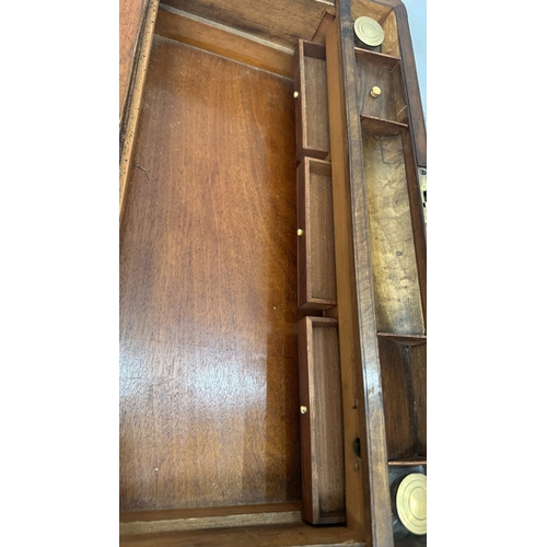 147 - A 19th century inlaid walnut and oak crossbanded writing slope with fitted interior and two glass in... 