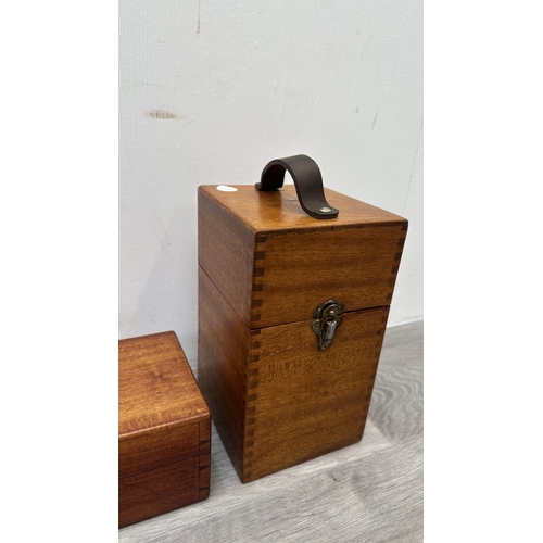 148 - Four items, one Chinese red lacquered wooden jewellery cabinet with brass decoration and carved cork... 