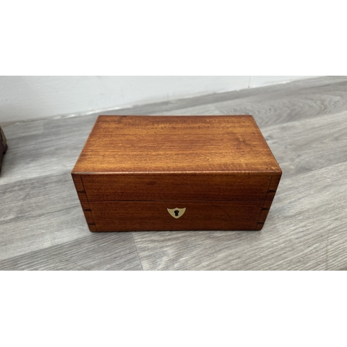 148 - Four items, one Chinese red lacquered wooden jewellery cabinet with brass decoration and carved cork... 