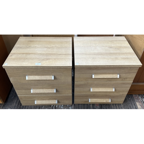 155 - A pair of modern oak effect bedside chests of drawers - approx. 50cm high x 48cm wide x 42.5cm deep