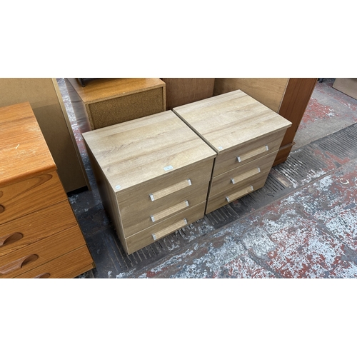 155 - A pair of modern oak effect bedside chests of drawers - approx. 50cm high x 48cm wide x 42.5cm deep