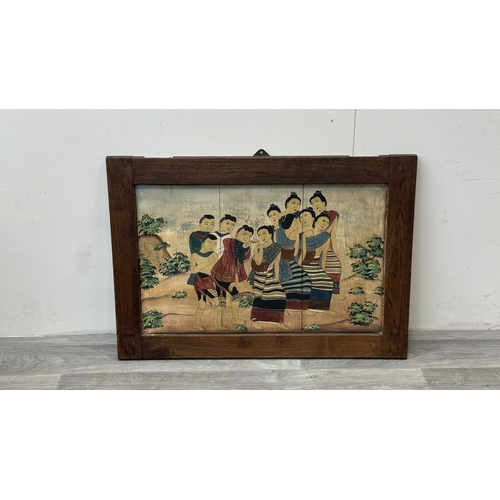 157 - A framed Thai mural wooden panel painting - approx. 57.5cm high x 82.5cm wide