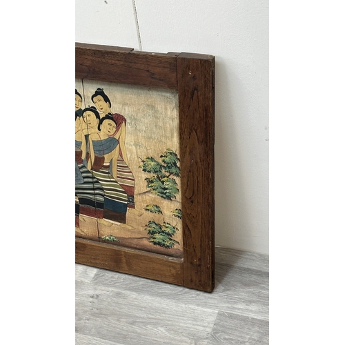 157 - A framed Thai mural wooden panel painting - approx. 57.5cm high x 82.5cm wide