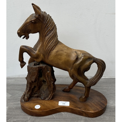 159 - A mid 20th century hand carved wooden horse sculpture - approx. 36cm high x 30cm wide