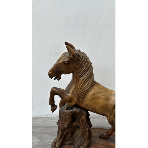 159 - A mid 20th century hand carved wooden horse sculpture - approx. 36cm high x 30cm wide