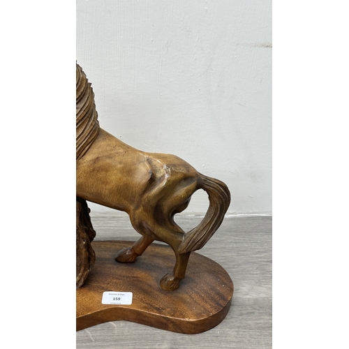 159 - A mid 20th century hand carved wooden horse sculpture - approx. 36cm high x 30cm wide