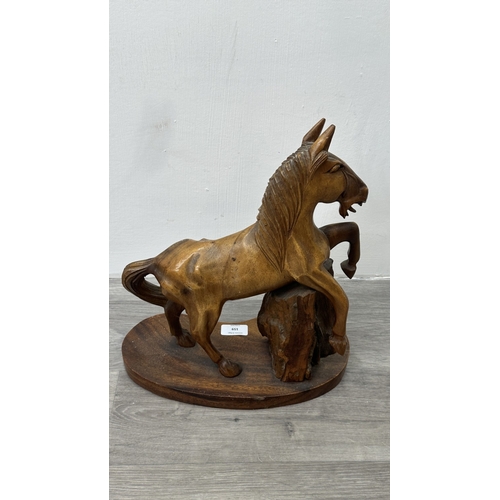 159 - A mid 20th century hand carved wooden horse sculpture - approx. 36cm high x 30cm wide
