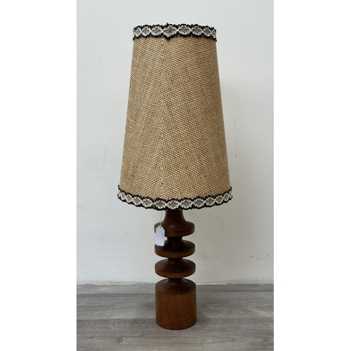 161 - A mid 20th century teak table lamp with brown and beige fabric shade - approx. 66cm high including s... 