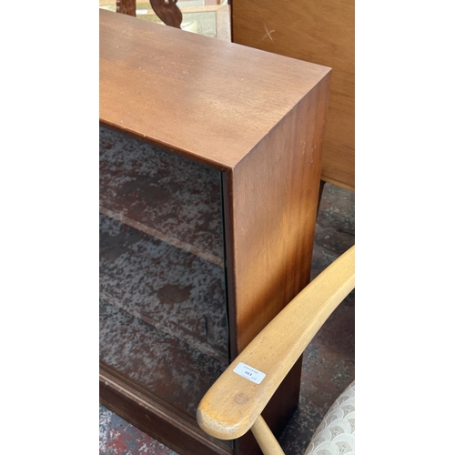 162 - A mid 20th century Herbert E. Gibbs teak bookcase with two glass sliding doors - approx. 83cm high x... 