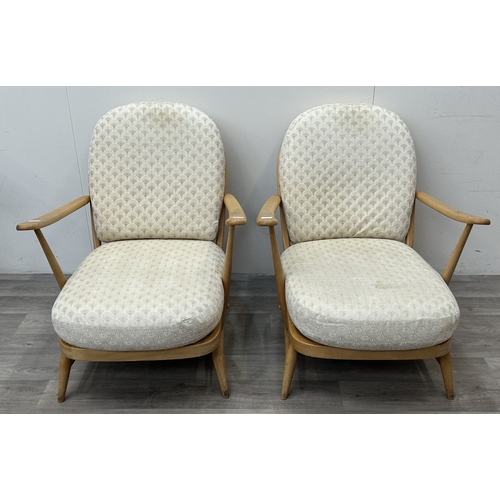 163 - A pair of mid 20th century Ercol Windsor Model 203 blonde beech armchairs with cream fabric upholste... 