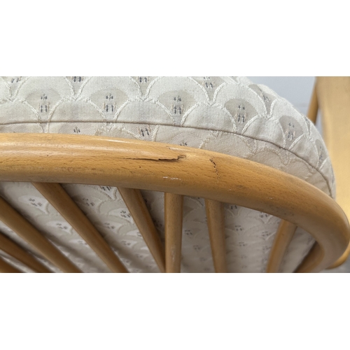 163 - A pair of mid 20th century Ercol Windsor Model 203 blonde beech armchairs with cream fabric upholste... 