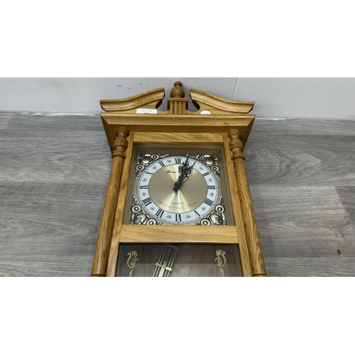 166 - Two items, one late 19th/early 20th century carved mahogany cased aneroid barometer and one late 20t... 