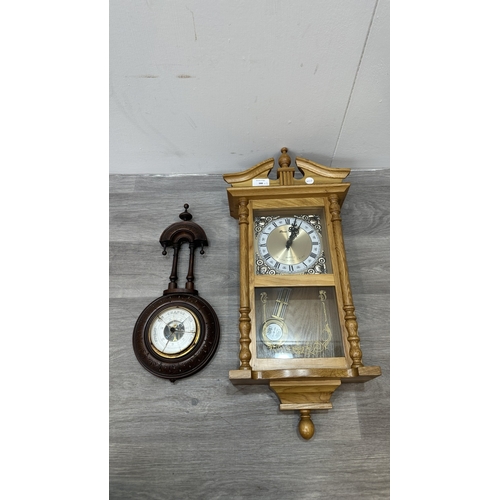 166 - Two items, one late 19th/early 20th century carved mahogany cased aneroid barometer and one late 20t... 