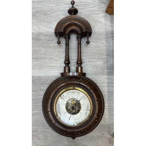 166 - Two items, one late 19th/early 20th century carved mahogany cased aneroid barometer and one late 20t... 