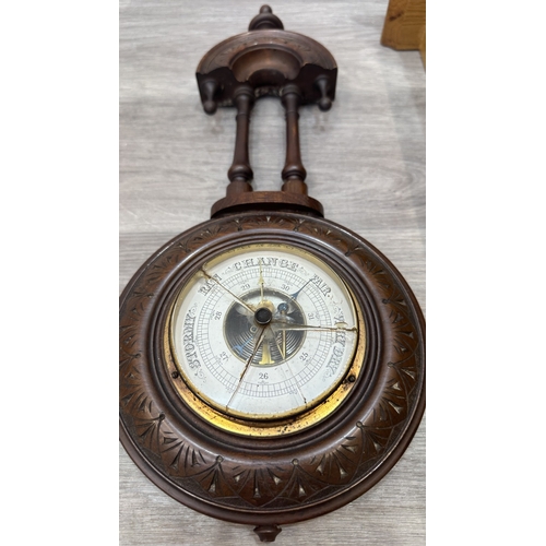 166 - Two items, one late 19th/early 20th century carved mahogany cased aneroid barometer and one late 20t... 