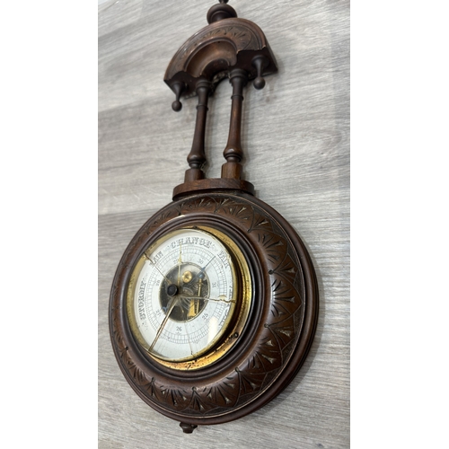 166 - Two items, one late 19th/early 20th century carved mahogany cased aneroid barometer and one late 20t... 