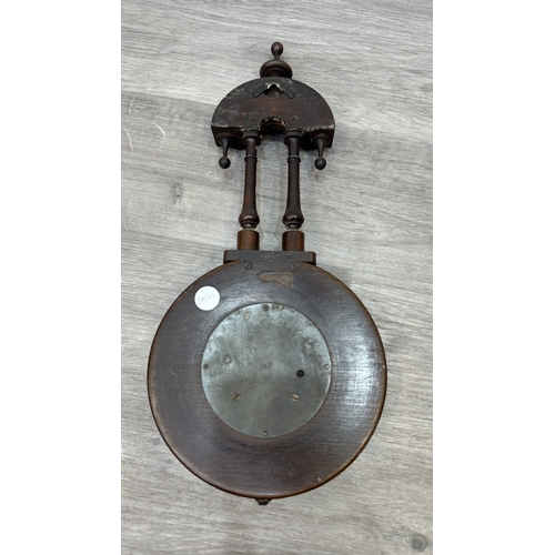 166 - Two items, one late 19th/early 20th century carved mahogany cased aneroid barometer and one late 20t... 