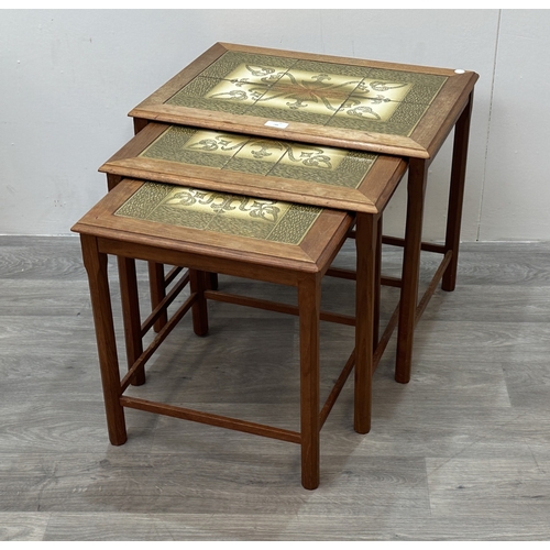 169 - A mid 20th century Danish teak and tiled top nest of three tables - approx. 48cm high x 55cm wide x ... 