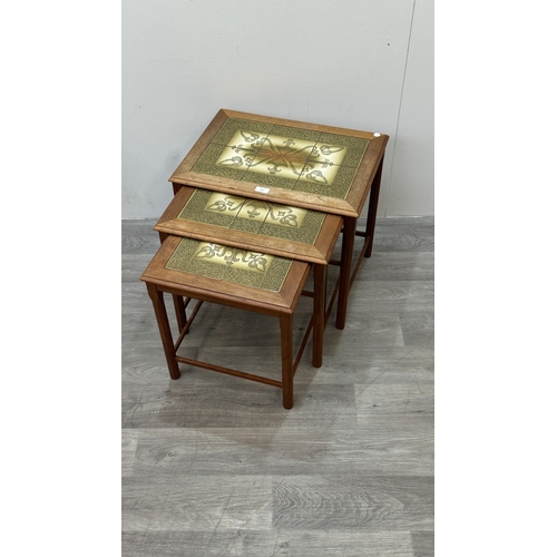 169 - A mid 20th century Danish teak and tiled top nest of three tables - approx. 48cm high x 55cm wide x ... 