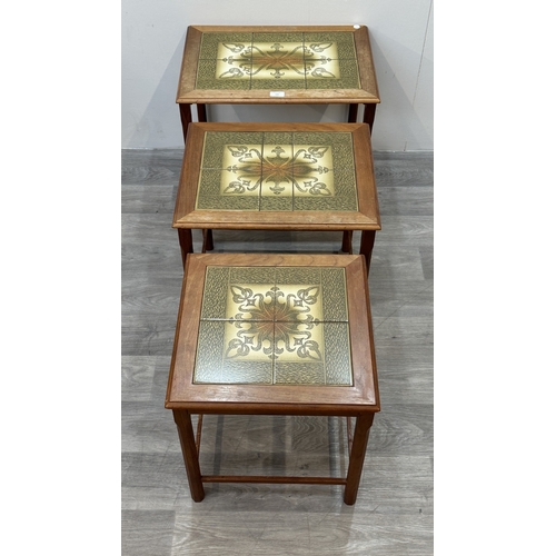 169 - A mid 20th century Danish teak and tiled top nest of three tables - approx. 48cm high x 55cm wide x ... 