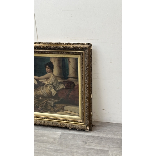 172 - A late 19th/early 20th century gilt framed Konrad Kiesel (1846-1921) 'The Mandolin Player' print - a... 